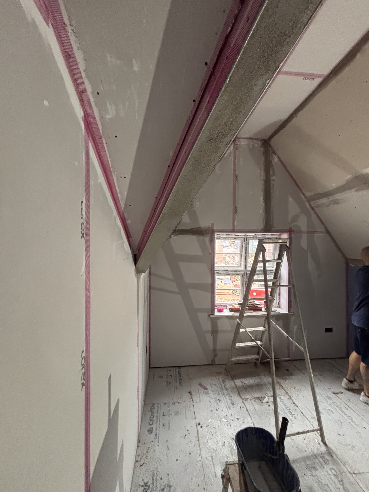 Plasterboard joints taped and filled ahead of skimming