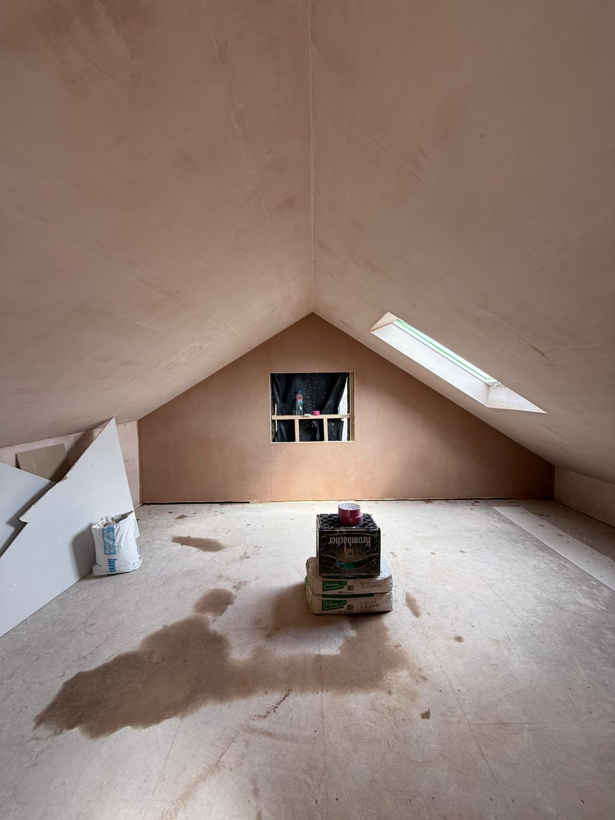 The finished skimmed vaulted loft room with dormer window