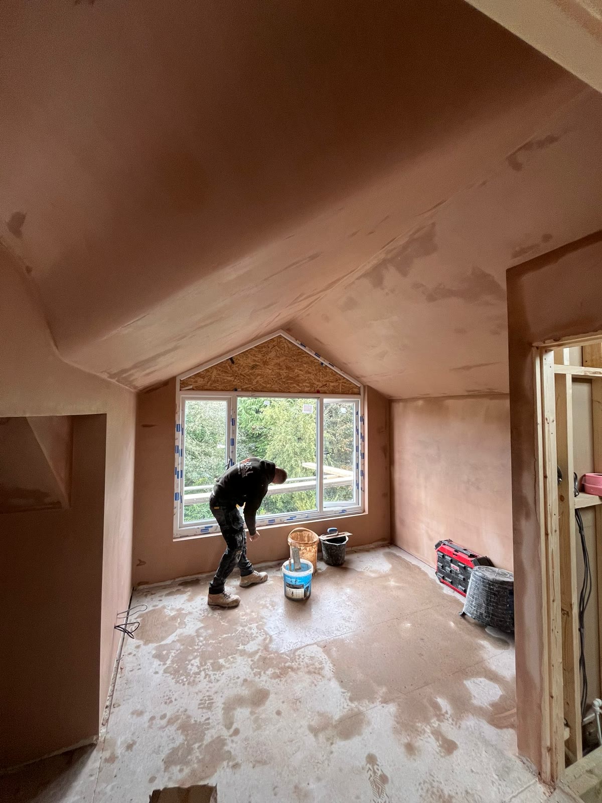 One of the D&L team skimming a vaulted ceiling on a new build