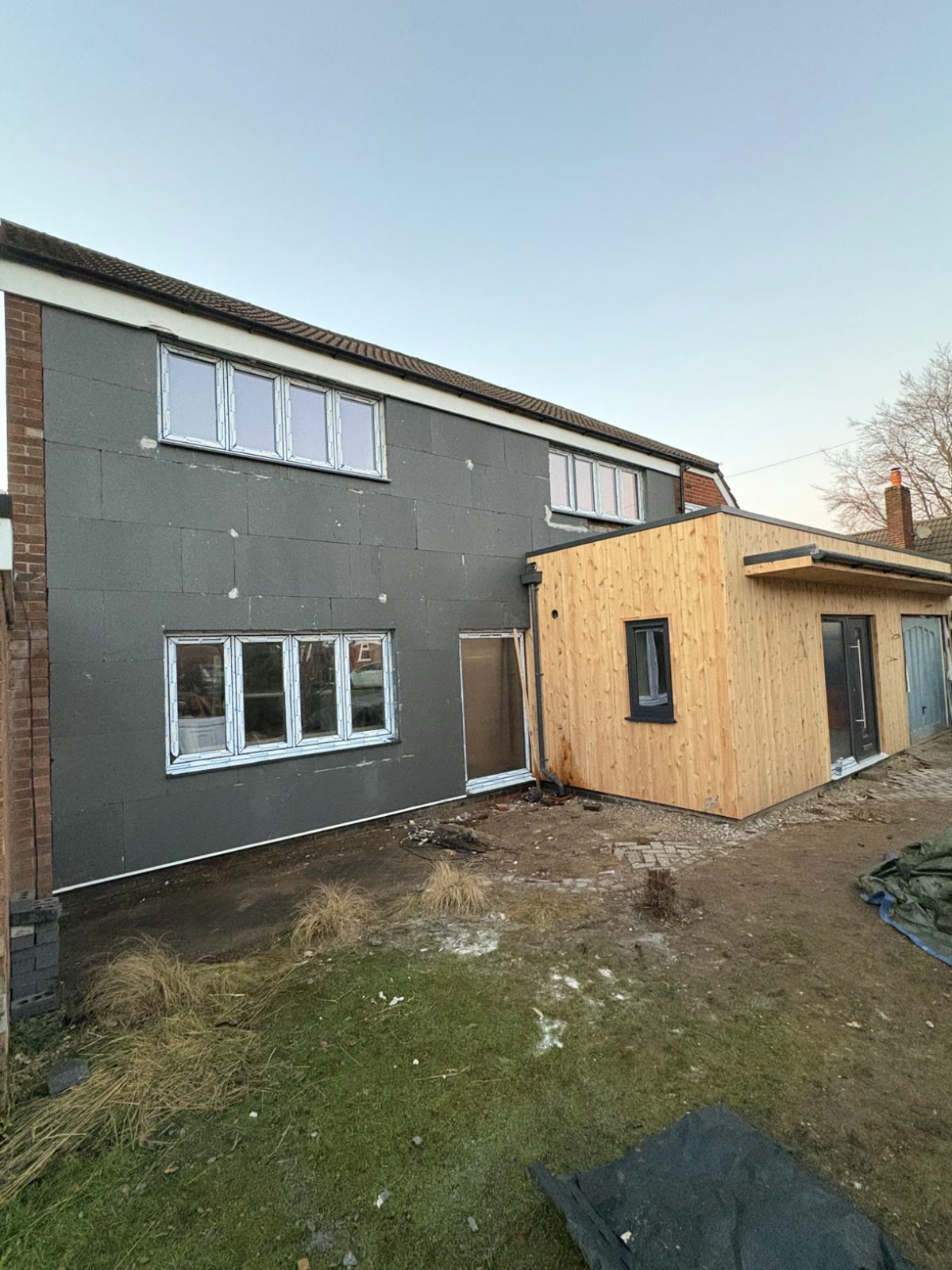 External wall insulation boards fixed to a house ready for rendering